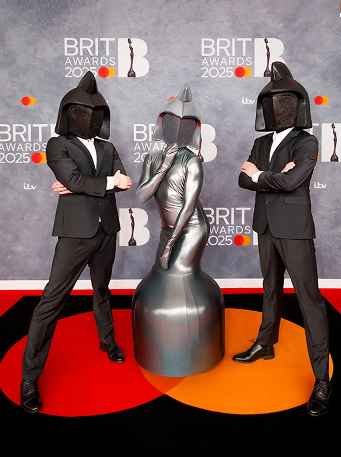 People gather at an outdoor event with a scenic city view and a prominent dome in the background.