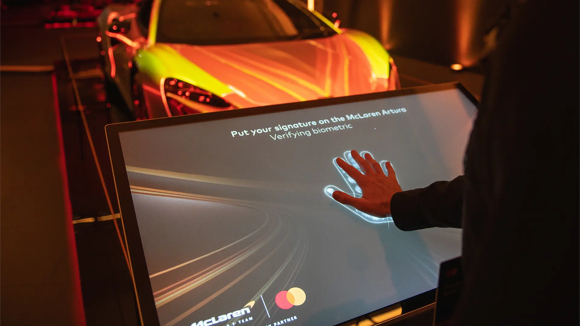 Touch activation Attendees exploring an interactive automotive experience at the Mastercard Innovate event.